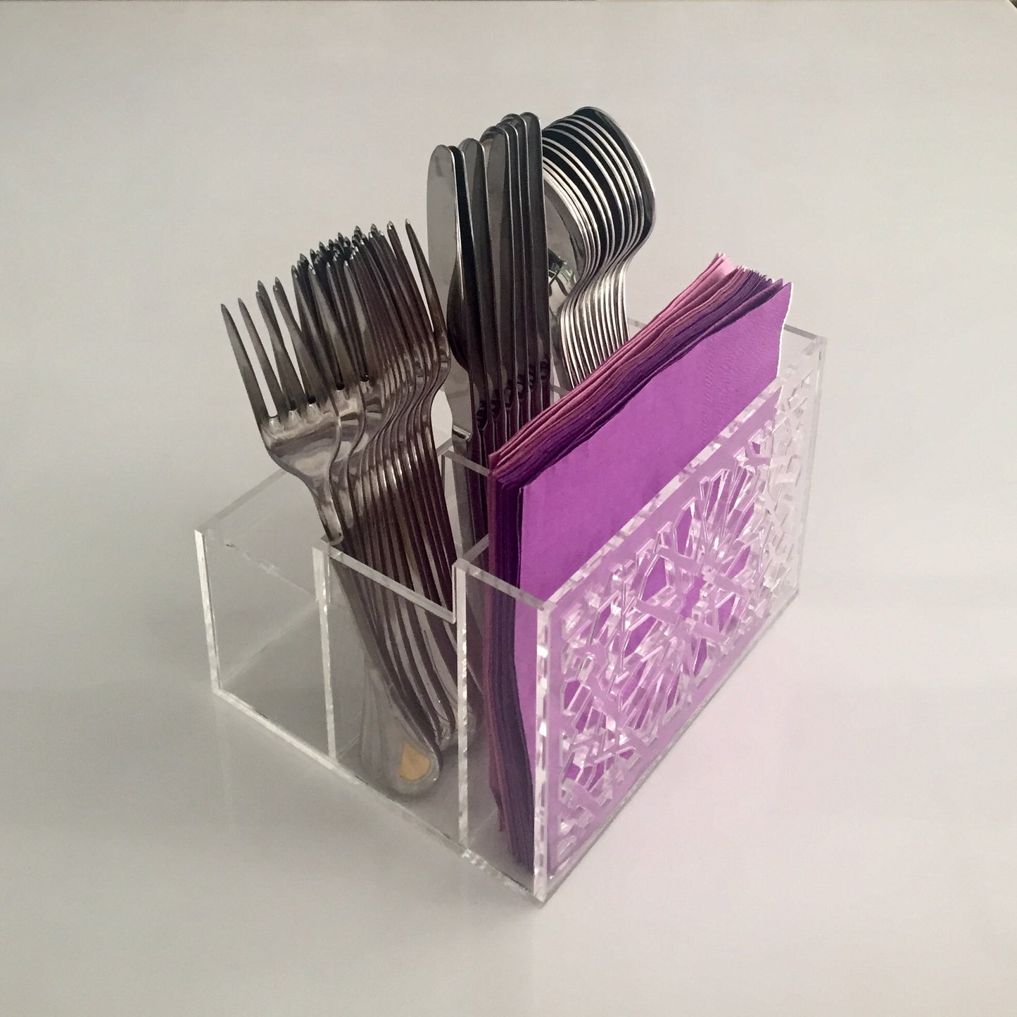 Cutlery holder with engraved design